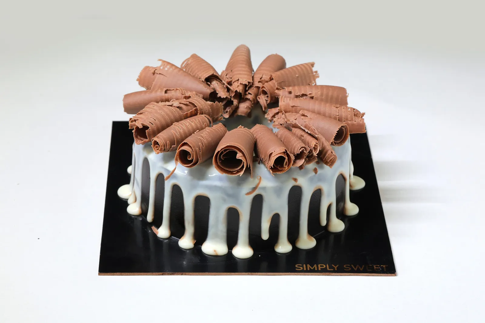 Eggless chocolate curl drip cake by Simply Sweet bakery Udaipur