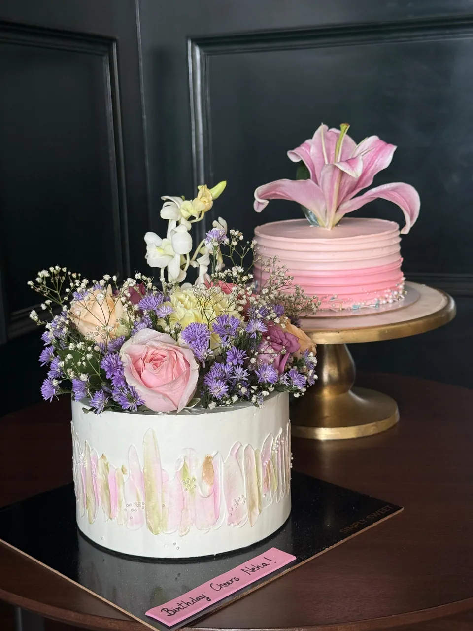 Custom cake styled with a fresh flower bouquet by Simply Sweet Udaipur
