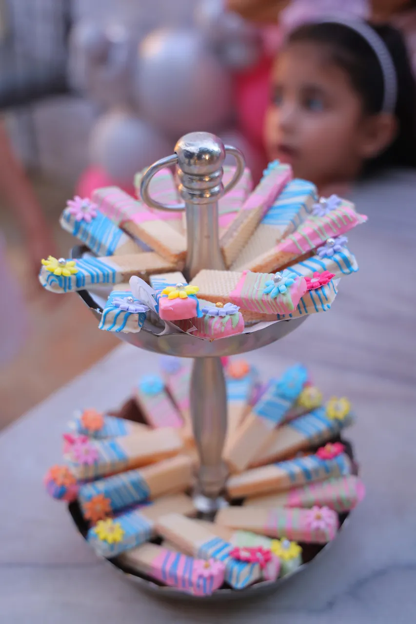 Chocolate dipped wafers on a tiered stand at a kids party by Simply Sweet Udaipur