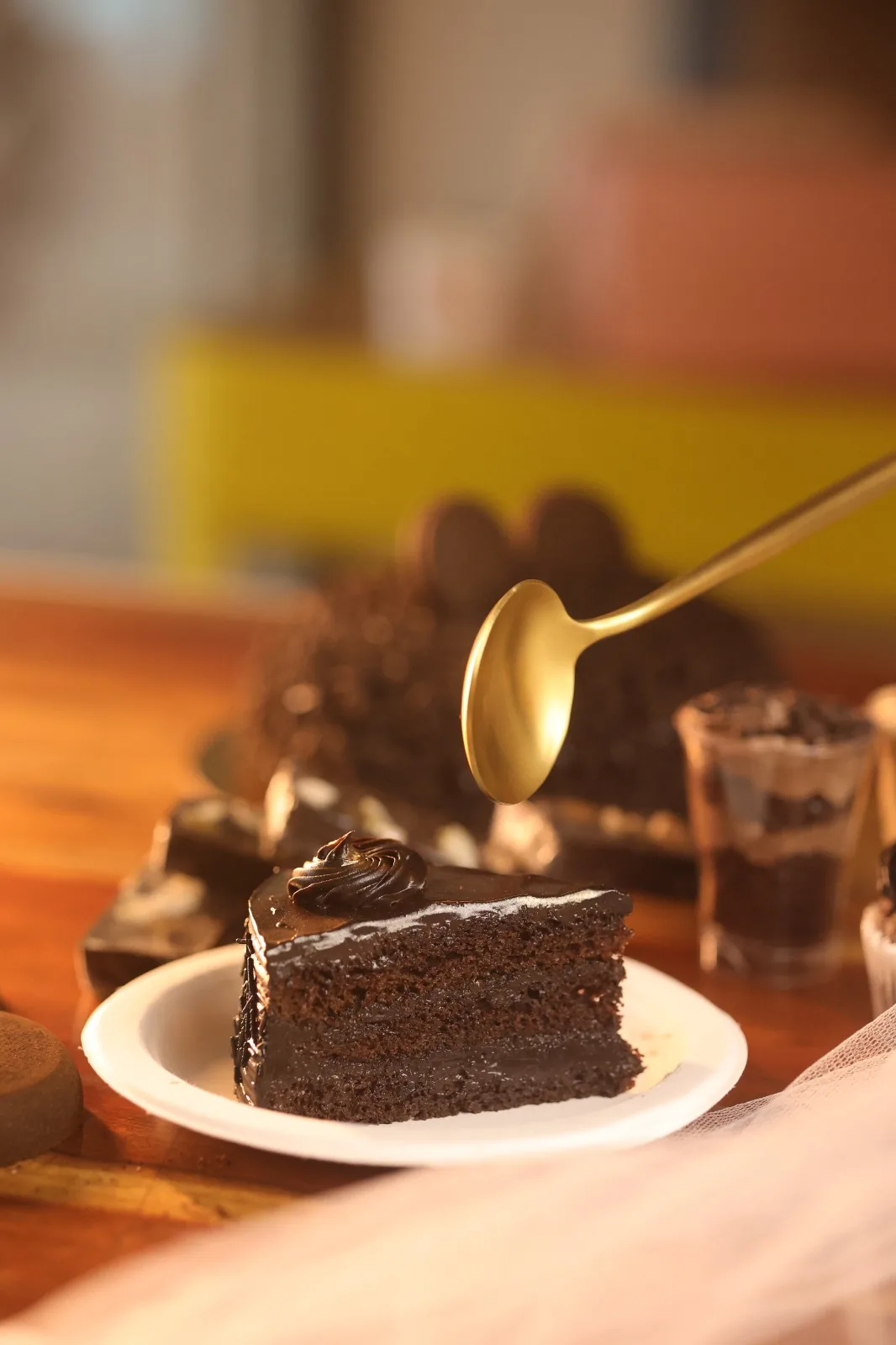 Slice of eggless chocolate cake by Simply Sweet Udaipur