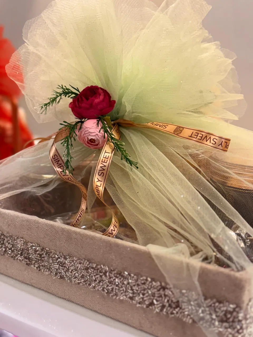 Floral tulle wrapped gift tray by Simply Sweet Udaipur
