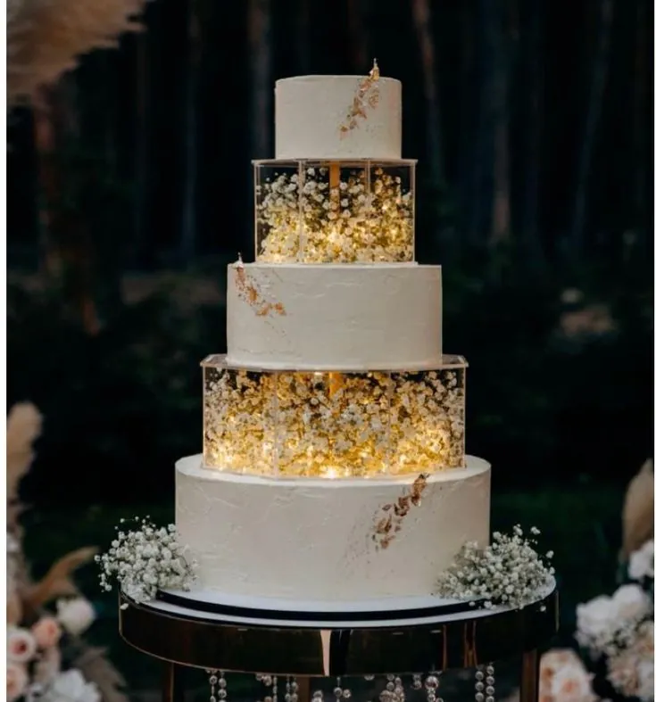 Five-tier white wedding cake with illuminated acrylic tiers of baby's breath by Simply Sweet Udaipur