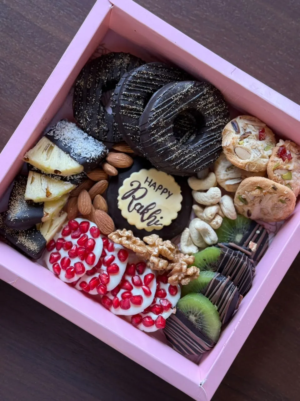 Rakhi gift hamper with chocolate-dipped treats by Simply Sweet Udaipur